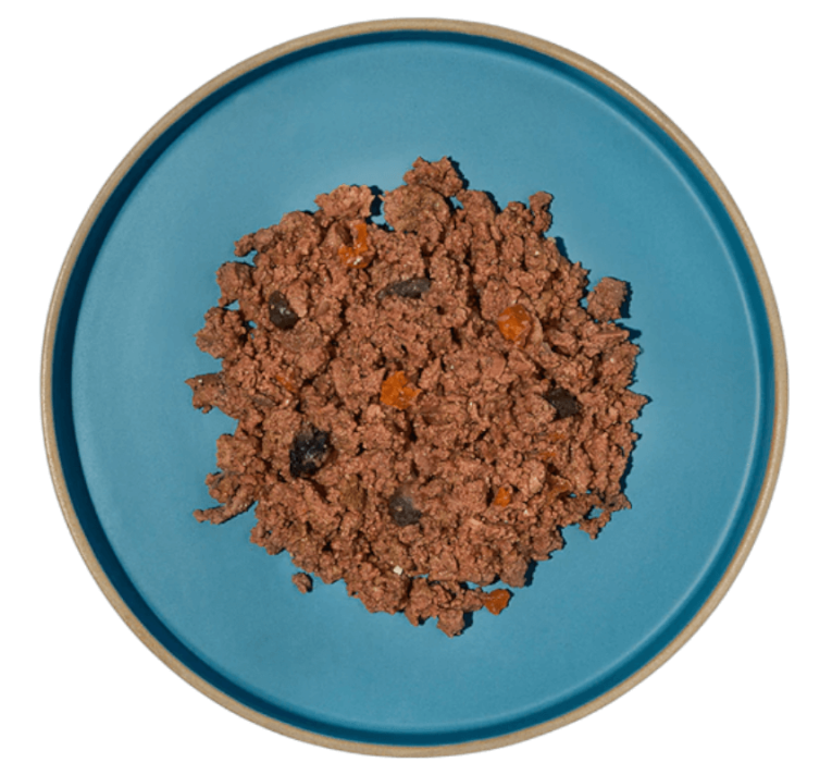 Comida húmeda cremosa de cerdo ibérico en plato, textura paté sin cereales