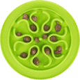 Vista cenital del comedero slow feed redondo Trixie de 24cm, color verde limón, con porciones de alimento húmedo esparcidas en el patrón central de ondas que simulan una flor o estrella.