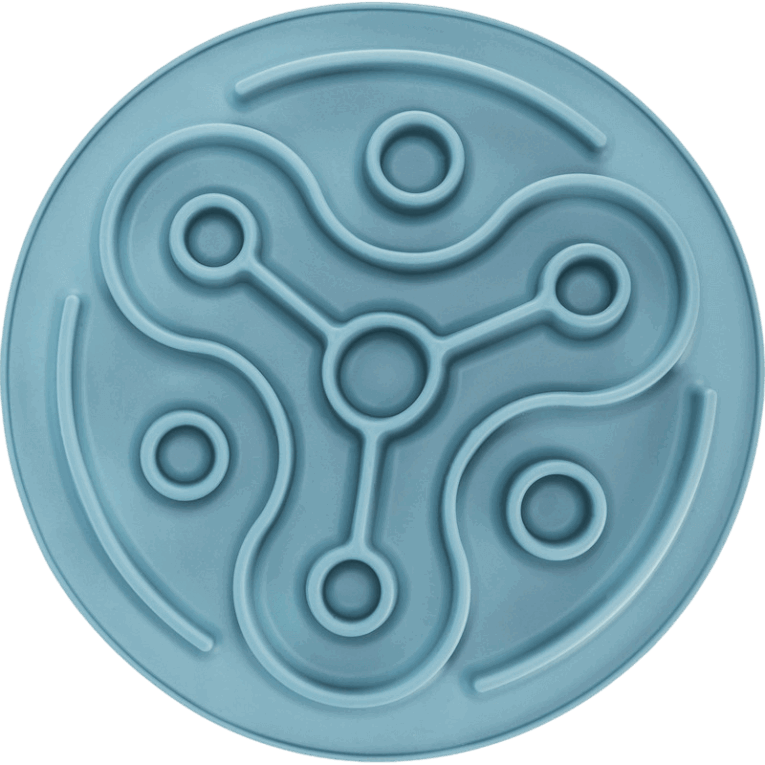 Vista cenital del mantel Slow Feeding Trixie azul de 28cm vacío, destacando la simetría del laberinto curvo con tres puntos centrales y anillos concéntricos.