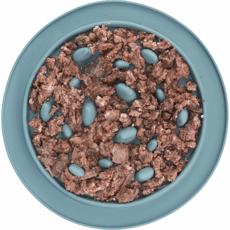 Vista cenital del comedero Slow Feed Trixie de 24cm en color azul claro, completamente relleno de alimento húmedo (carne picada o paté). Los obstáculos elevados en forma de aleta obligan al perro a lamer el alimento.